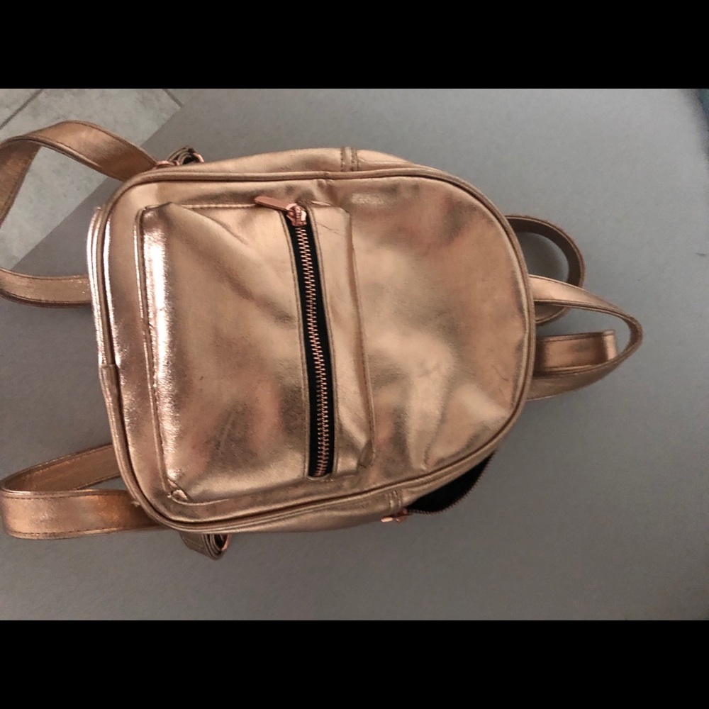 Holographic gold backpack